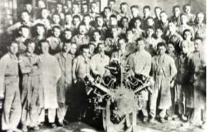 FMA technical staff, engineers and operators next to the first built engine