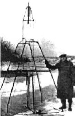 Robert Goddard with his first liquid fuel rocket engine