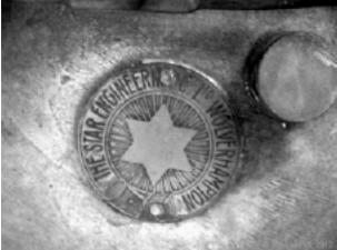 Star logo on a stamped and riveted brass plate