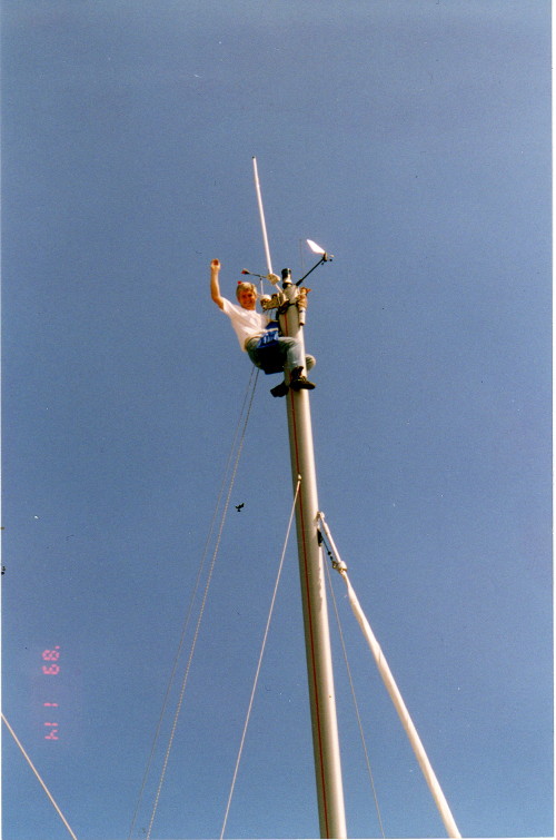 Theo working on top of sailing yacht mast